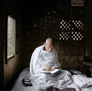 Mahatma Gandhi sitting and writing in his hut, Bangladesh, Asia, November 1946, Asia