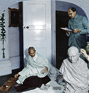 Mahatma Gandhi spinning and talking to Mahadev Desai, October 22, 1931