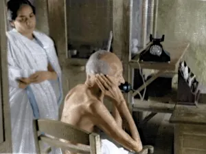 Mahatma Gandhi talking on telephone from office hut, Wardha, India, Asia, 1940, Asia