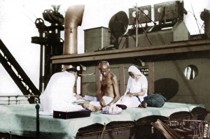 Mahatma Gandhi working on sundeck during voyage to England, India, Asia, September 1931, Asia