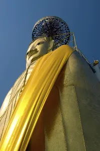 The main feature of Bangkok's Wat Intharawihan is the 32-metre high standing Buddha called either Luang Pho To or