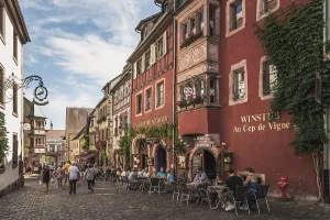 Main street with historic houses in the old town centre of Riquewihr