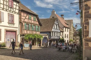 Main street with historic houses in the old town centre of Riquewihr