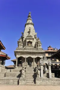 Majestic Buddhist stupa in Nepal against a deep blue sky