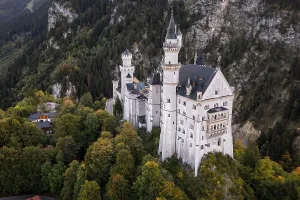 A majestic castle with towers in the middle of the forest