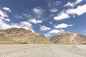 Majestic mountains rise under a clear blue sky