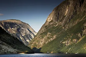 Majestic panorama of Naeroyfjord near Gudvangen with high mountains and still water