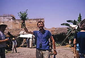 Male tourist holding up a bunch of mint, Moulay Idriss Zerhoun, Morocco, North Africa, 1971, Africa
