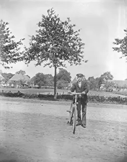 Man with bicycle, cyclist, ca. 1920-1930