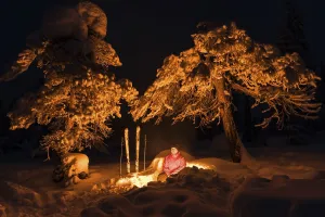 Man at campfire, Norrbotten, Lapland