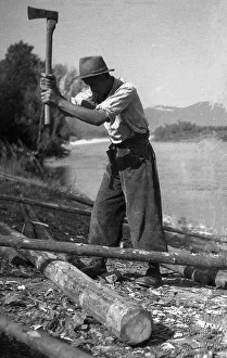 Man chopped wood with an axe, ca
