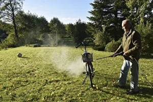 Man cleans bicycle with high-pressure cleaner