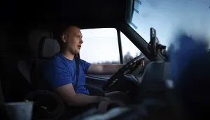 Man driving van in the evening