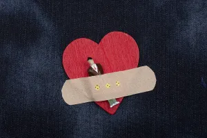 Man figurine on heart icon, Love and Valentines day concept