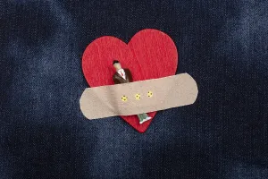 Man figurine on heart icon, Love and Valentines day concept