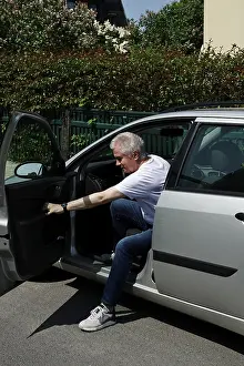 Man gets into a car, Germany