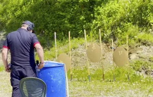 Man with Handgun and Sport Training IPSC Shooting