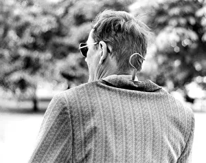 Man with hanger in jacket, ca. 1980s