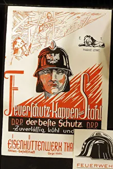 Man with historical steel fire helmet