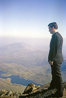 Man looking at the view from the summit of Mount Snowdon, Snowdonia, North Wales, Great Britain 1966