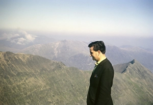 Man looking at the view from the summit of Mount Snowdon, Snowdonia, North Wales, Great Britain 1966