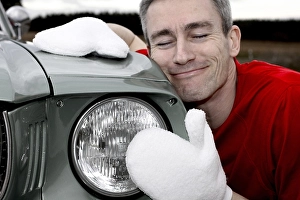 Man lovingly caring for his vintage car