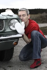 Framed Print : Man lovingly caring for his vintage car Framed Print : Man lovingly caring for his vintage car