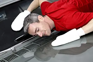 Man lovingly caring for his vintage car