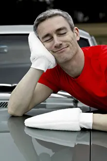 Man lovingly caring for his vintage car