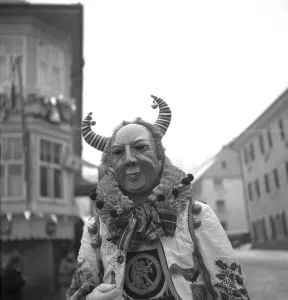 Man with mask on a parade, carnival