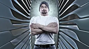 Man posing like a macho with his arms folded