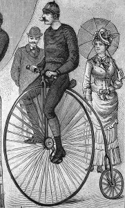 Man riding a Penny Farthing bicycle
