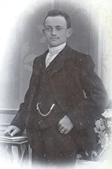 Man, in suit with watch chain, visiting format