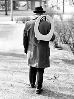 Man with toilet seat, ca. 1980s