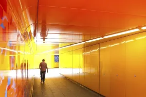 Man walking through an underpass in London