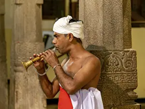 Man with wind instrument, Temple of the Tooth