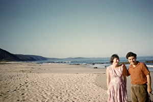 Man and woman standing on the sandy beach of Lorne, Victoria, Australia, 1956, Oceania