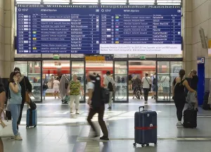 Mannheim main station, interior view with people and display board