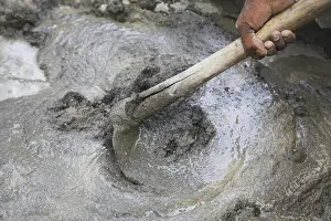 Category Historic EN Prints: Manually mixing cement sand and water for plaster with help of spade hoe