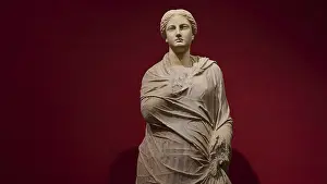 Marble statue of a woman in draped shawls