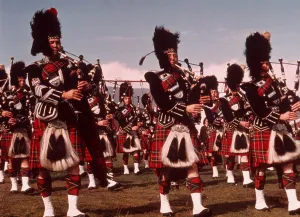 Marching band pipers playing bagpipes Scottish Highland games, Aboyne, Scotland, UK c 1960s
