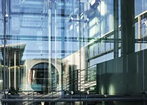 The Marie-Elisabeth Luders House is reflected in the window of the Paul Lobe House