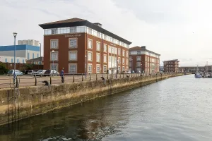 Marina House modern office and apartment building development on quays of marina