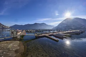 Marina, motorboats, lake, mountains