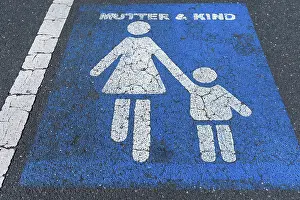 Marking on tar, parking lot for mother and child