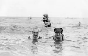 Married couple on holiday swimming in the sea