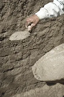 Category Historic EN Prints: Mason using patter and trowel for plastering mixture of cement on wall
