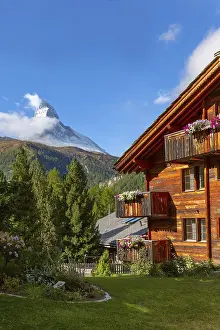 Matterhorn snow mount and Zermatt alpine houses panorama