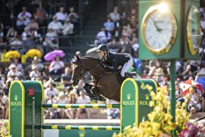 Max Kuhner of Austria riding Elektric Blue P compete in the first round of the 1