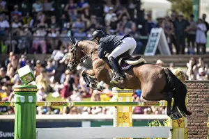 Max Kuhner of Austria riding Elektric Blue P compete in the first round of the 1